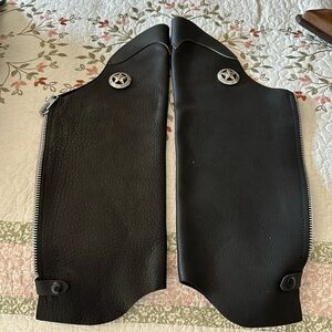 Leather chaps. Leather legs